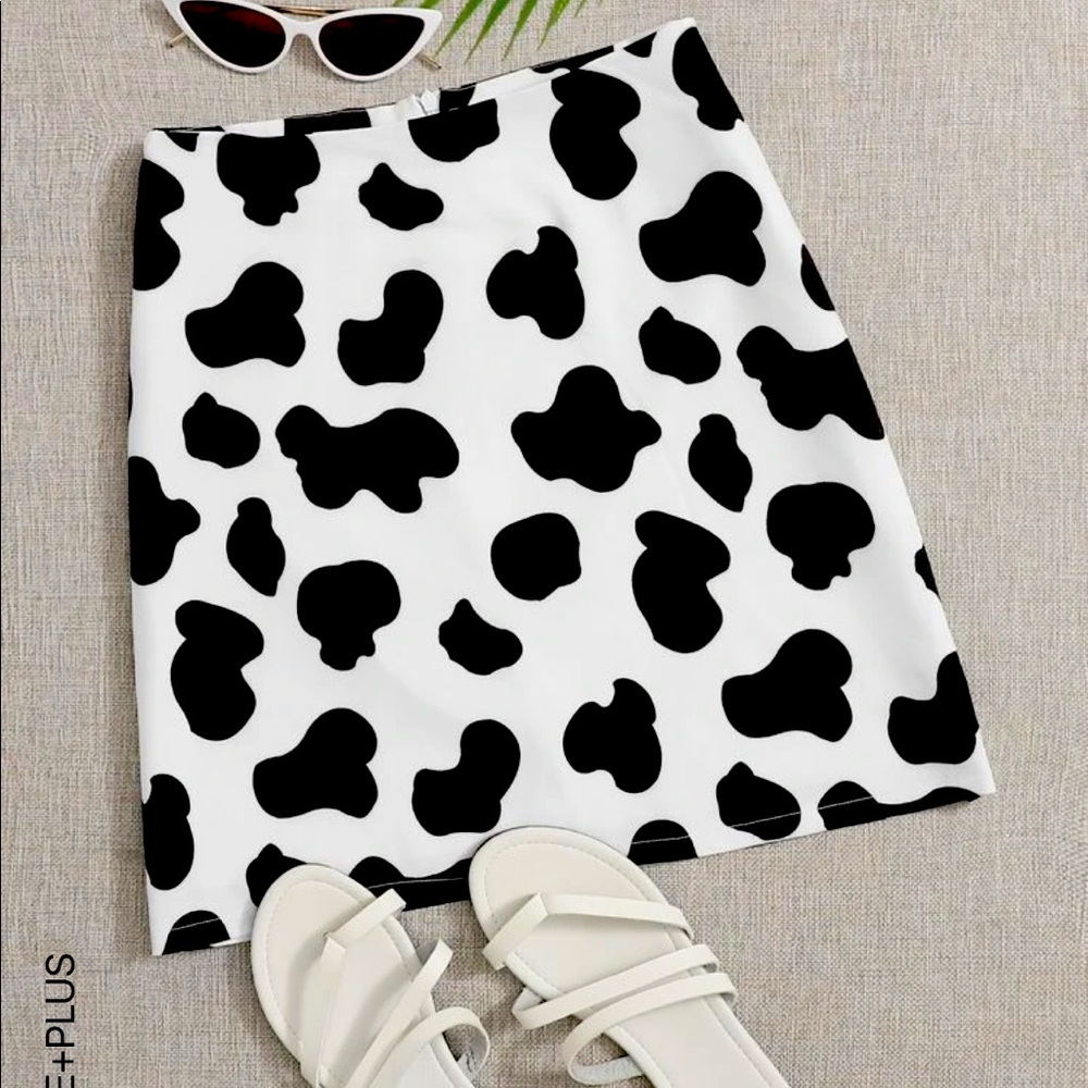 Cute cow print skirt with matching headband. Skirt is in a 3X. Price for both.